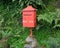 Red postbox, view from the right.