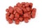 Red pre-drilled halibut pellets