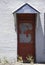 Red Private Door with white bricks