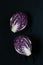 Red purple cabbages on a black background
