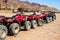 Red quads stand in a row on the shore of the Red Sea. Dahab, Egypt.