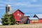 Red Quilt Barn with Evergreen Pine Trees and Silo