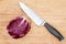 Red radicchio with a kitchen knife