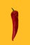 Red Ramiro Pepper on a yellow background.