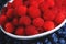 Red raspberries fruit background. Water drops on ripe sweet raspberry. Close up, top view, high resolution product. Collection of