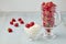 Red raspberries in a glass gravy boat with cream and in a glass goblet