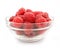 Red raspberry fruits in glass vase