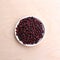 Red raw beans clean for cooking in a white saucer on the table upper  view