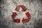 Red recycling symbol in grunge style. Environmental protection, ecology, recycling concept