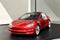 red reduced copy, toy, Tesla car model, electric vehicle in showcase, alternative energy development concept, Elon Musk company,