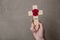 A red remembrance poppy on a wooden cross. Military remembrance day concept