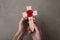 A red remembrance poppy on a wooden cross. Military remembrance day concept