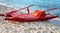 Red rescue boat on an italian beach