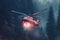Red rescue helicopter extinguishes a forest fire by dropping a large amount of water on a burning coniferous forest