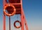 Red rescue tower with a lifeline against the blue sky