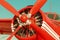 Red retro biplane, engine close up