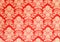 Red retro wallpaper with golden floral texture, victorian design