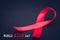 Red ribbon awareness on black background for World Aids day