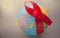 The red ribbon on the background of the globe is an international symbol of struggle, a symbol of compassion, support and hope for