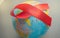 The red ribbon on the background of the globe is an international symbol of struggle, a symbol of compassion, support and hope for