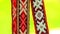 Red ribbon decoration with white slavic pattern. Slavic amulets with ornament