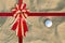 Red Ribbon on A golf ball on the sand for background
