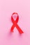 The red ribbon is an international symbol of HIV and AIDS awareness