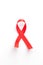 The red ribbon is an international symbol of HIV and AIDS awareness