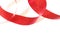 Red ribbon, spiral coil On white paper background