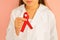 The red ribbon is a symbol of the memory of people who died of AIDS
