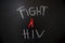 Red ribbon with text of fight HIV