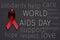 Red ribbon and text world aids day