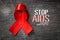 Red ribbon with text world aids day awareness campaign