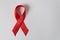 Red ribbon on white background. Aid control symbol. Directly above