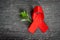 Red ribbon for world aids day awareness campaign background