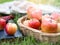 Red ripe apple in basket in autumn vibes.