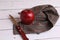 Red ripe apple on the fabric next to a knife