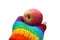 Red ripe apple in a hand in a rainbow glove