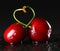 Red ripe cherries form a heart