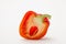 Red ripe sweet pepper in a cut on a white background
