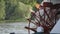 Red Riverboat Paddle Wheel in a River with Trees