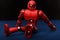 Red robot sitting
