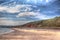 Red rock beach Dawlish Warren Devon England on a summer day in HDR