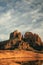 Red rock cathedral rock illuminated during sunset reflecting on small natural pool in the american southwest of Sedona Arizona