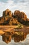 Red rock cathedral rock illuminated during sunset reflecting on small natural pool in the american southwest of Sedona Arizona