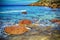 Red rocks in Castelsardo shoreline in hdr