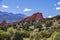 The red rocks of the Garden of the Gods thrusting up with the Rocky Mountains in the background and pines of the high desert in th