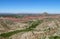 Red rocks and green valley mountain landscape