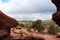 Red rocks, hills and dirt with evergreen trees on the Siamese Twins Trail at Garden of the Gods in Colorado