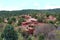 Red rocky mountains covered in evergreen and deciduous trees on the Siamese Twins Trail in Colorado Springs